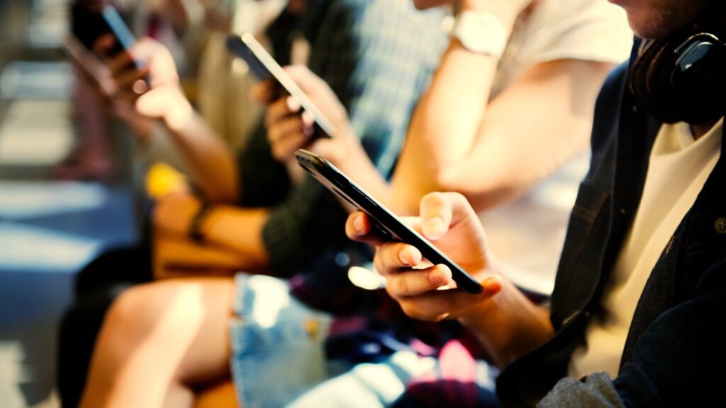 Association members engaging with their mobile devices